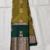 Semi Kanchi Pattu Handloom Saree in Olive Gold with Emerald Green Peacock Zari Border Semi Kanchi Pattu Handloom Saree Olive Gold & Emerald Green with Peacock Zari Border | Traditional Silk Saree