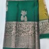 Semi Kanchi Pattu Handloom Saree in Olive Gold with Emerald Green Peacock Zari Border Semi Kanchi Pattu Handloom Saree Olive Gold & Emerald Green with Peacock Zari Border | Traditional Silk Saree