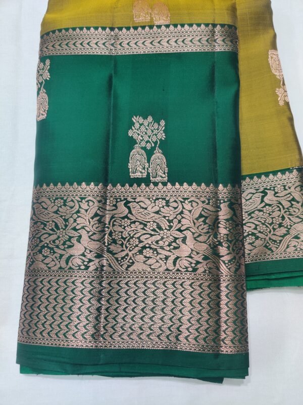Semi Kanchi Pattu Handloom Saree in Olive Gold with Emerald Green Peacock Zari Border Semi Kanchi Pattu Handloom Saree Olive Gold & Emerald Green with Peacock Zari Border | Traditional Silk Saree
