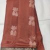 Rust colour Skut border butta design with green pallu