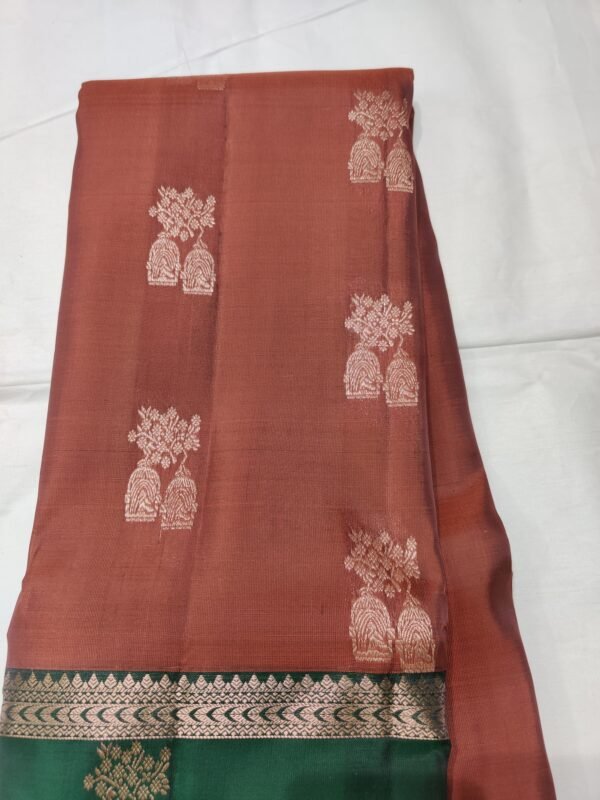 Rust colour Skut border butta design with green pallu
