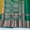 Semi Kanchi Pattu Handloom Saree in Olive Gold with Emerald Green Peacock Zari Border Semi Kanchi Pattu Handloom Saree Olive Gold & Emerald Green with Peacock Zari Border | Traditional Silk Saree
