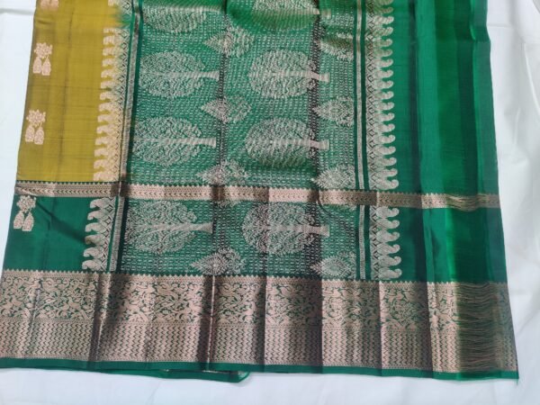 Semi Kanchi Pattu Handloom Saree in Olive Gold with Emerald Green Peacock Zari Border Semi Kanchi Pattu Handloom Saree Olive Gold & Emerald Green with Peacock Zari Border | Traditional Silk Saree