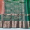 Rust colour Skut border butta design with green pallu