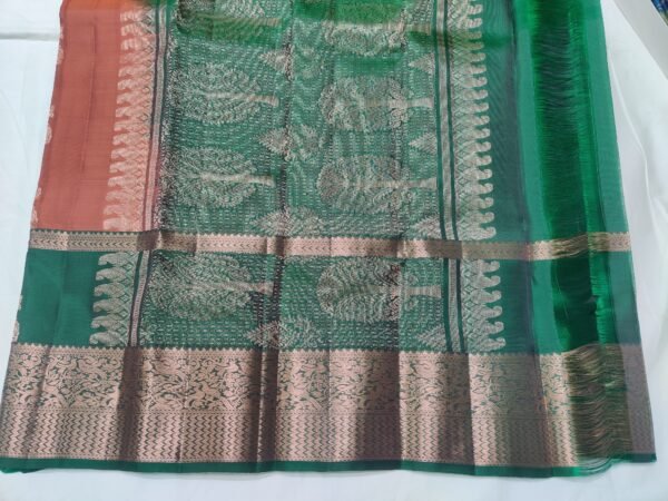 Rust colour Skut border butta design with green pallu