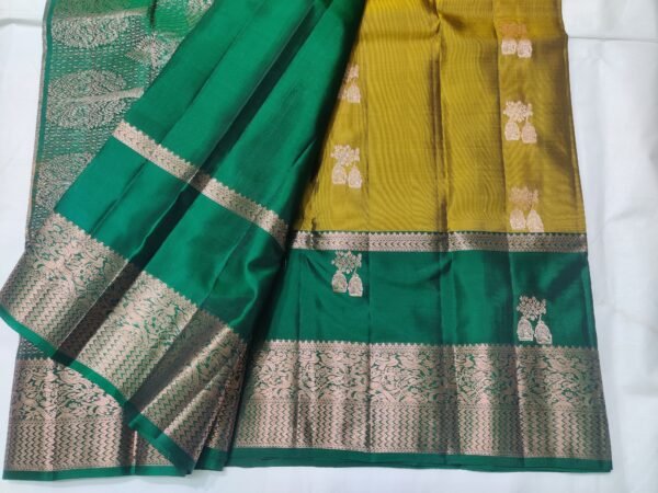 Semi Kanchi Pattu Handloom Saree in Olive Gold with Emerald Green Peacock Zari Border Semi Kanchi Pattu Handloom Saree Olive Gold & Emerald Green with Peacock Zari Border | Traditional Silk Saree