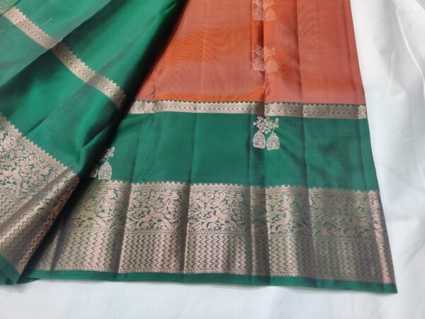 Rust colour Skut border butta design with green pallu